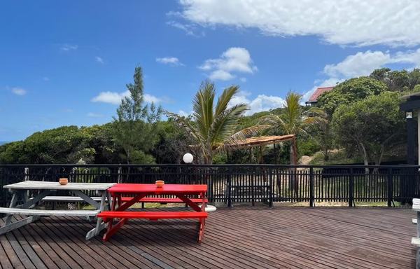 Deck with picnic tables overlooking ocean at Sunset Beach Resort Mozambique